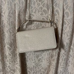 Light pink metallic thread clutch